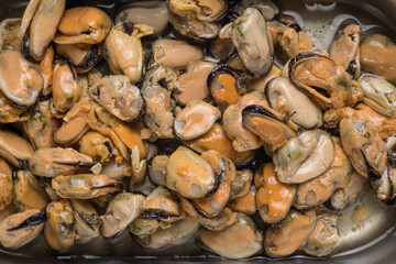 Mussel meat in oil. Close-up