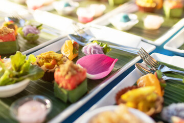 A variety of traditional Thai desserts and snacks serving on banana leaf. Royal Thai cuisine. - obrazy, fototapety, plakaty