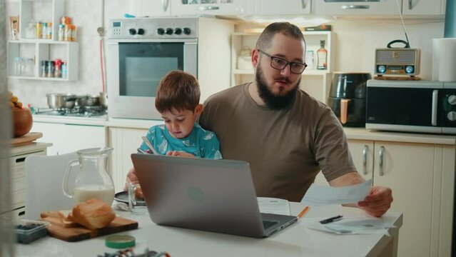 Frustrated father feeling stressed about high household payments, having financial problems or bank debt.