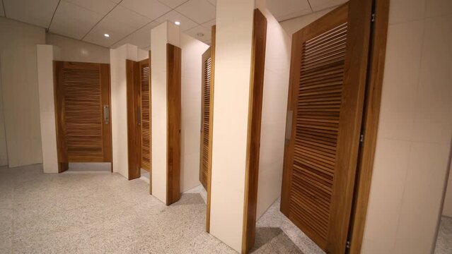 Urinals and toilet cubicles in shopping center Aviapark.