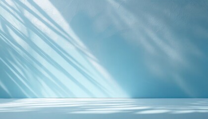 minimalistic abstract gentle light blue background for product presentation with sunny light and intricate shadow on wall