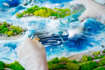 The process of making the art decor of epoxy resin, natural stones and moss