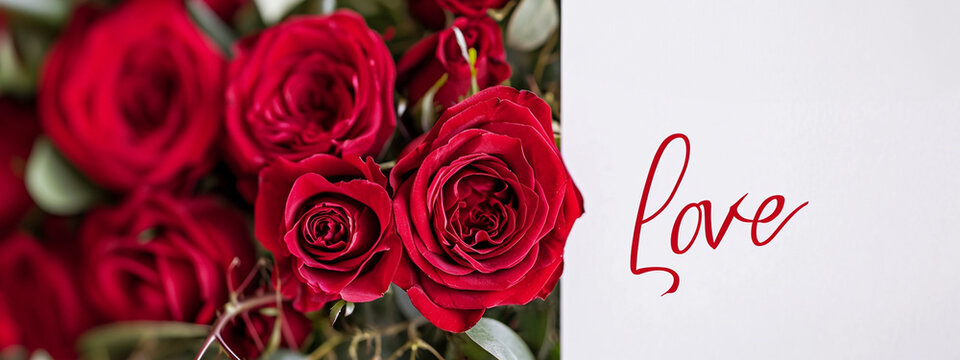 red roses and the inscription love, close-up