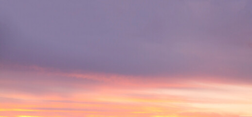 Grey and pink clouds dark sunlight sky background