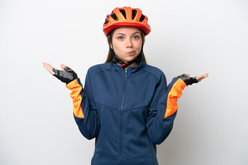 Young cyclist Lithuanian woman isolated on white background having doubts while raising hands