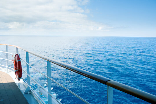 View of still blue sea from ship deck