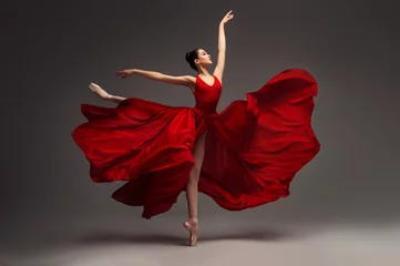 Stickers fenêtre École de danse Ballerina. Young graceful woman ballet dancer, dressed in professional outfit, shoes and red weightless skirt is demonstrating dancing skill. Beauty of classic ballet.