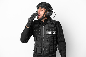 SWAT caucasian man isolated on white background yawning and covering wide open mouth with hand