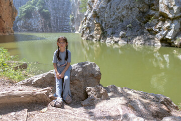 girl explore a scenic park with a river, mountains, enjoying nature