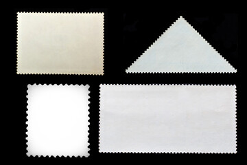 Set of blank aged postage stamps isolated on black background. Texture of paper. Template for graphic designers	