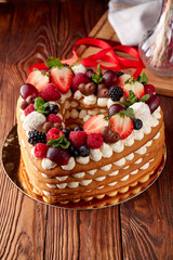 Fruit and Cream Layered Cake on Festive Table - 714638190