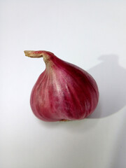 Fototapeta premium red onion on a wooden board