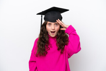 Little student girl wearing a graduated hat isolated on pink background with surprise and shocked facial expression