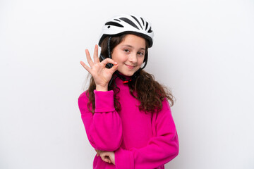 Little cyclist girl isolated on white background showing ok sign with fingers
