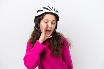 Little cyclist girl isolated on white background shouting with mouth wide open