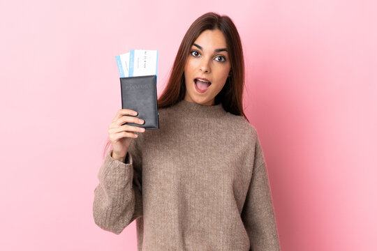 Young Caucasian Woman Isolated On Pink Background Happy In Vacation With Passport And Plane Tickets