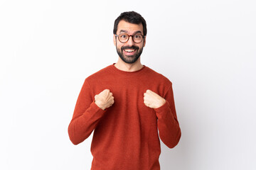 Caucasian handsome man with beard over isolated white background with surprise facial expression