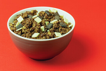 Granola with oatmeal and chocolate in a bowl