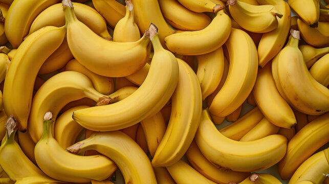  a large pile of ripe bananas sitting on top of a pile of other bananas in a pile on top of a pile of other bananas on top of a table.