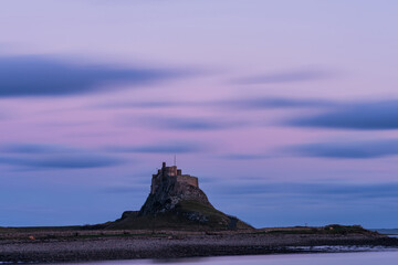 Stunning dramatic landscape image of Lindisfarne, Holy Island in Northumberland England during...