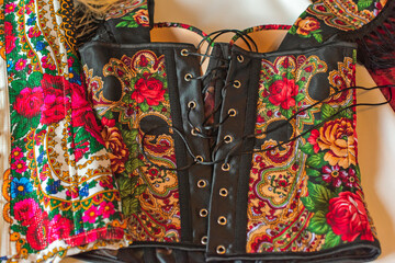 Ethnic embroidered corset, flowers details. Concept of beauty Slavic women, Boho style 