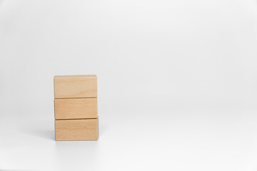 building wood blocks on white background; business or creative concept