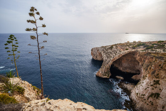 Natural stone arch and sea caves at Blue Grotto, Malta