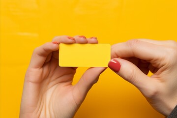 Blank magazine design template held by female hands on yellow background   mockup image