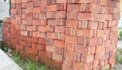 Piles of red brick building materials