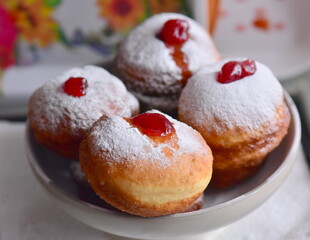 Tasty donuts with jam. Hanukkah sweets