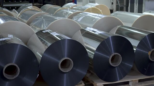 Foil in large rolls. Large bobbins with foil inside printing house