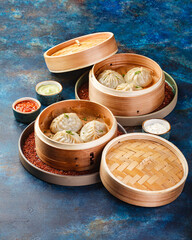 Traditional Asian national food Manti, Manta or Manty, like dumplings in bamboo steamer