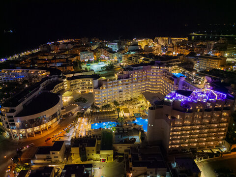 St. Paul's Bay hotels in Malta at night. Aerial wide view of illuminated Bugibba and Qawra tourist destinations.