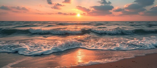 Scenic Black sea sunset with calm waves, cloudy sky, and coastal shore.