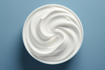 Delicious Dairy Cream on Natural White Background: Top View of Healthy Skin Product in a Jar
