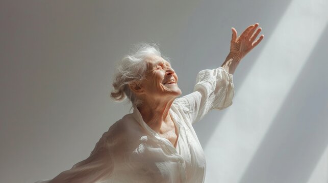 Happy old woman with gray hair dancing , open young energy 