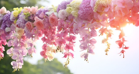   Artificial Wisteria Vine Hanging Flower, weeding Décor Colorful artificial  flowers hanging on a stage. wedding decoration. Plastic colorful decorated flower.  