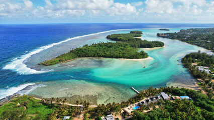 Tropical island coral lagoon beautiful sea view from above. Cook Islands Rarotonga. Cook islands paradise. Beautiful tropical island of Rarotonga view of the blue sea in the lagoon.