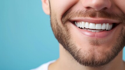 Wide shot with copy space on man's perfect teeth smile on blue with copy space . - obrazy, fototapety, plakaty
