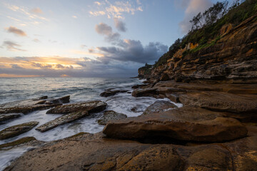 Fototapeta premium Cloudy morning view around rocky headland coastline.