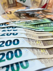 Closeup of 200 euro banknotes with a blurred plane on the back, increasing the price of air...