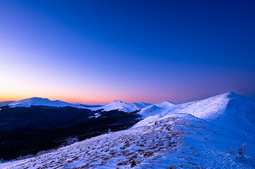 Winter sunset in the mountains. Bieszczady National Park, Poland.