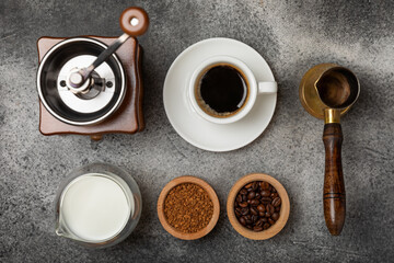 Obraz na płótnie Canvas Ingredients for making coffee. Different ways to make coffee geyser moka maker,turkish coffee pots (cezve). Coffee making concept with milk, cinnamon and star anise. Flat Lay. Top view. Copy space