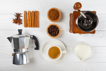 Ingredients for making coffee. Moka pot, Turkish coffee pots (cezve), coffee grinder with coffee...