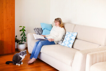 Woman reading magazine in cozy room