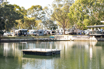 Fototapeta na wymiar Small lake with pontoon in Australian caravan park