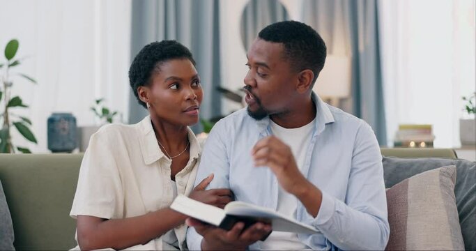 Bible, reading and black couple on sofa with spiritual faith, worship and conversation in home. Religion, marriage and gospel, christian man and woman on couch together with holy book, love and trust