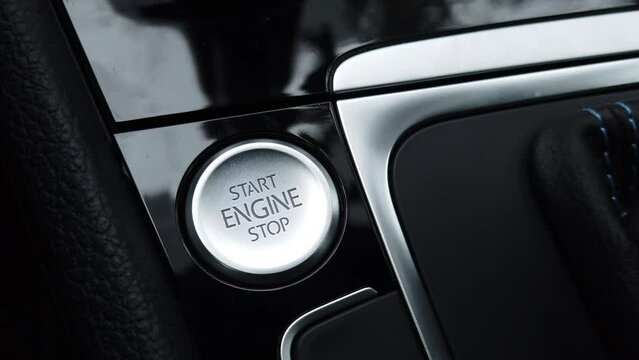 close up pressing car engine start stop button 4K