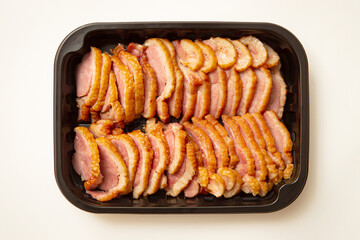 Sliced duck meat in packaging container
