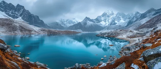 Foto auf Acrylglas panorama of beautiful glacier mountains covered with snow with a lake © DailyLifeImages